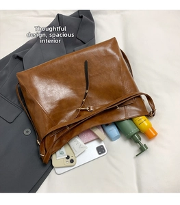 Top view of spacious brown leather tote bag interior showing ample storage capacity