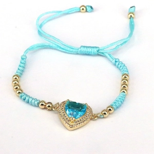 Blue heart woven bracelet with gold beads and adjustable cord in minimalist style
