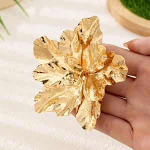 Elegant large gold 3D flower brooch with polished metallic texture for formal evening wear