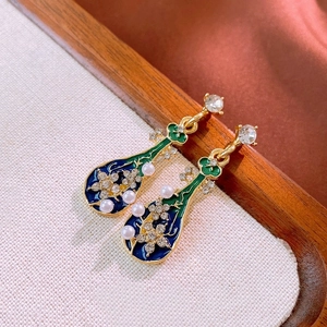 Detail of Pipa-shaped Chinese earrings with enamel inlay, pearls and rhinestones