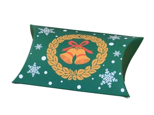 Detail of a green Christmas pillow candy box with festive gold wreath and red bow patterns