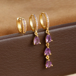 Three-piece set of gold hoop earrings featuring elegant purple waterdrop zirconia stones