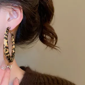 Retro leopard print hoop earrings for women in large gold metal with aesthetic design