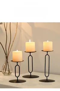Modern black metal candle holders in three sizes for romantic dining table decoration