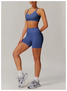 Detail of navy blue high-waist yoga shorts and seamless fabric texture for fitness
