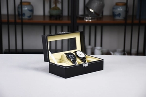 Detail view of a 6-slot black PU leather watch display box with clear glass lid
