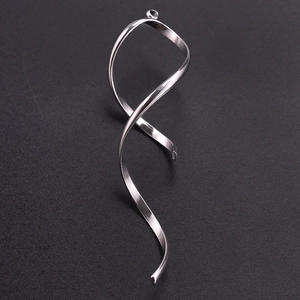 Macro view of a 304 stainless steel ribbon-shaped pendant with a polished silver finish