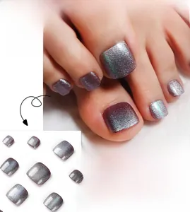 Detail of purple cat-eye press-on toenails with shimmering glitter and metallic finish