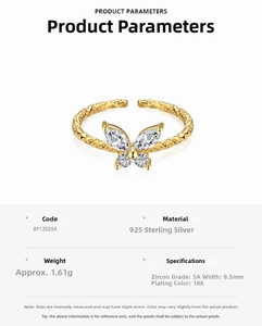 Detailed spec view of a gold 925 silver butterfly ring with cubic zirconia settings