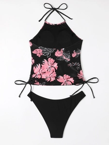 Flat lay detail of floral halter bikini top with adjustable side drawstrings and black bottoms