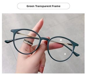 Detail of round green glasses frame with gold metal temples and model number 9328 engraving