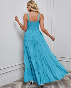 Detail view of the layered tier design and blue vertical stripes on back of the dress