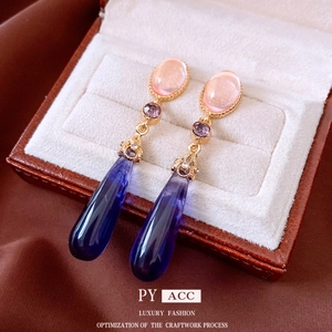 Vintage gold drop earrings with pink, purple and blue crystals in a luxury jewelry box