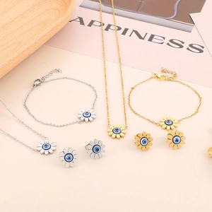 Sunflower jewelry set with blue evil eye stone including gold and silver necklaces