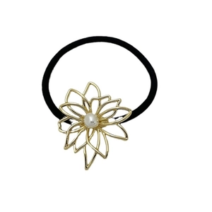Elegant gold flower pearl hair tie with black elastic band on white background