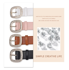 Detail showing high-quality leather belts with rhinestone-encrusted oval buckles in four colors