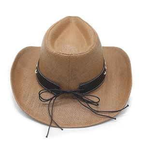 Detailed close-up of brown woven cowboy hat featuring a black leather band and bow detail