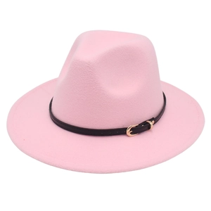 Detail shot of pink wool fedora hat featuring a black leather band and metal buckle
