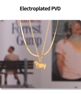 Detailed macro of 18k gold plated snake chain with a cute Corgi dog pendant
