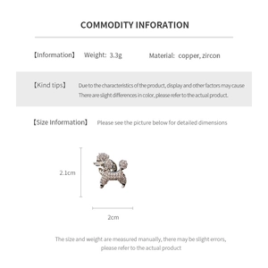 Macro view of silver poodle brooch featuring copper material and zircon crystal details