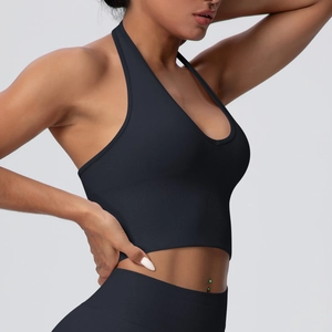 Detail shot of the seamless ribbed texture on the dark gray halter yoga sports top