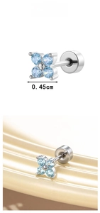 Macro detail of 0.45cm light blue zircon flower cartilage stud with screw back