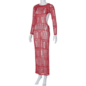 Detail of red knit dress showing the hollow-out pattern and long sleeve texture
