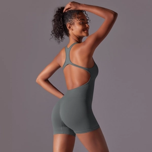 Detail of grey seamless yoga bodysuit featuring an open back and ribbed texture knit fabric