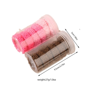Pink and brown jacquard hair ties in cylindrical containers with size measurements