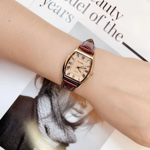 Women's vintage tonneau gold quartz watch with champagne dial and brown leather strap