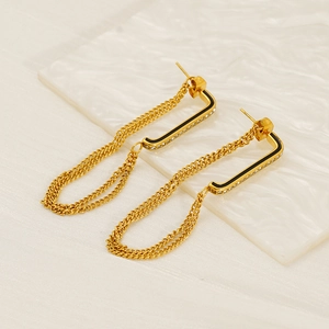 18K gold double layer chain tassel earrings with black enamel and zircons on marble