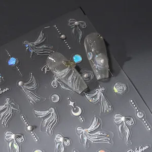 Macro view of 3D embossed ribbon and pearl nail stickers with laser aurora effect
