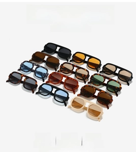 Flat lay of multiple color options for wide frame aviator style rectangular sunglasses