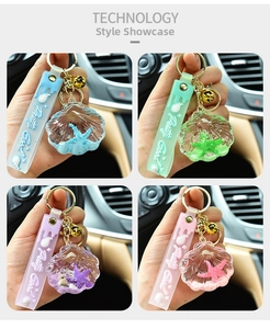 Detail of acrylic shell oil keychains with colorful starfish and silicone handles