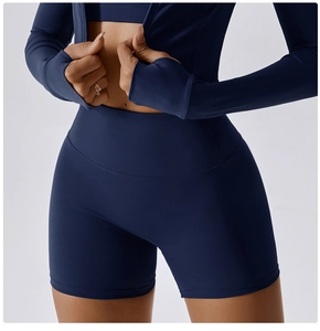 Detailed view of high-waisted navy blue yoga shorts with seamless elastic knit fabric
