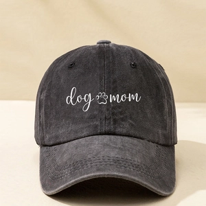 Detailed macro view of the Dog Mom print on the vintage washed black denim baseball cap