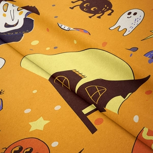 Close-up of soft velvet Halloween tapestry featuring cartoon ghost and castle prints