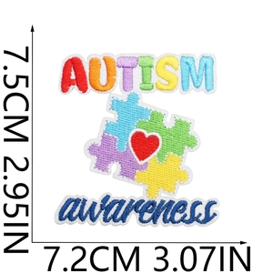 Detail shot of autism awareness embroidery patch with dimensions in centimeters and inches