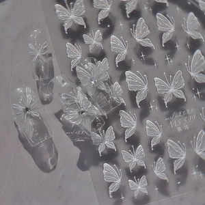 Macro view of 3D embossed butterfly nail stickers with jelly texture and glitter finish