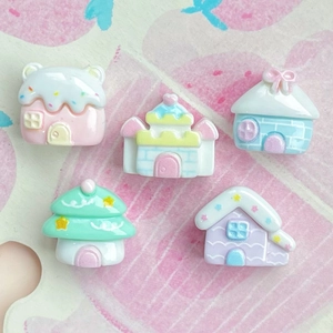 Detailed view of colorful miniature resin houses and candy-colored castles for DIY crafts