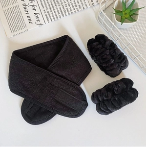 Detail of black microfiber headband with velcro and elastic wristbands set for skincare