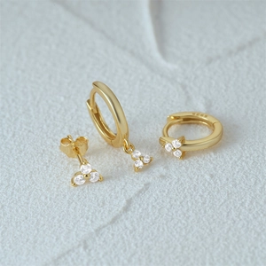 Detail of S925 hallmark on gold plated sterling silver trio diamond earring set