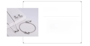 Detailed view of silver infinity jewelry set including necklace, bracelet and earrings