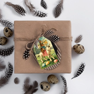 Flat lay of vintage Easter gift box with bunny tag, twine, and decorative eggs