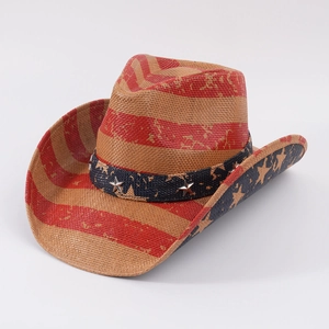 Detail of straw cowboy hat featuring American flag stripes and silver star studs