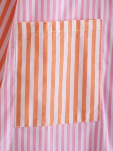 Detailed macro view of pink and orange striped pocket on a casual summer shirt