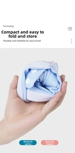Detail of light blue waterproof silicone shoe cover showing high flexibility and folding design