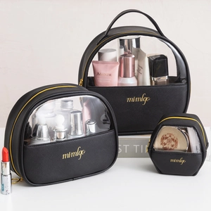 Three-piece black PU and transparent PVC makeup bag set with gold zippers and handles
