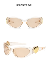 Detailed view of brown Y2K heart sunglasses with transparent frame and golden metal accents