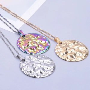 Three round hammered necklaces in gold, silver, and rainbow colors on fine O-chains